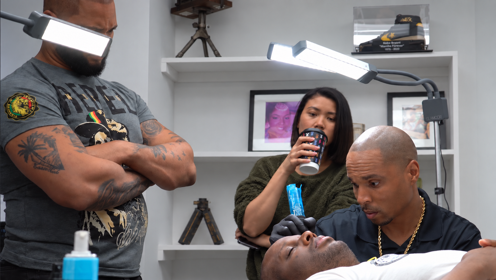 Don Whyte demonstrating scalp micropigmentation technique to students during hands-on SMP training